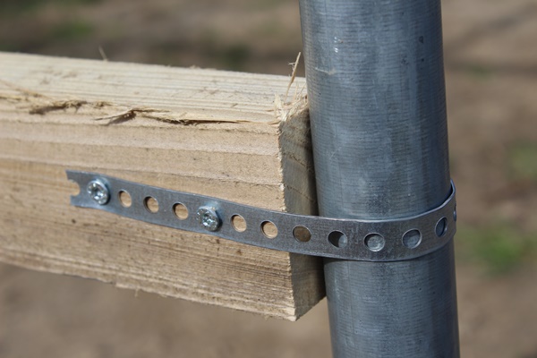 A batten attached with a perforated metal strip to a metal tube